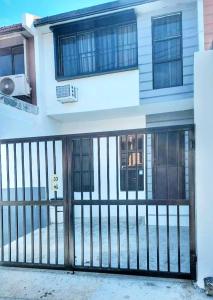 a house with a gate in front of it at RUSTIC THEMED - 2BR TownHouse - near Clark Airport - TRP4 in Mining
