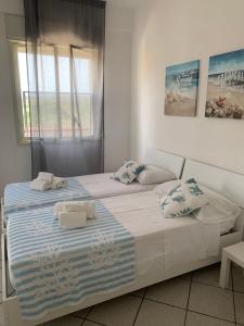 Katil atau katil-katil dalam bilik di LoVi apartments Porto Palo