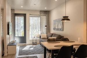 Posezení v ubytování Tuomenkartano Apartments by Hiekka Booking