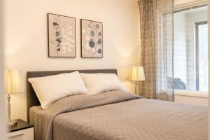 Postel nebo postele na pokoji v ubytování Tuomenkartano Apartments by Hiekka Booking