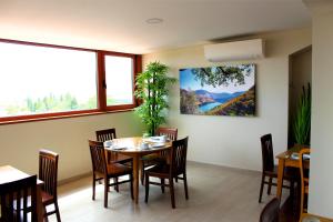 a dining room with a table and chairs at Hotel Vale Do Côa in Vila Nova de Foz Coa +32 photos