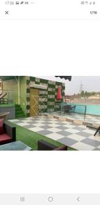 a rendering of a patio with a pool and a table at Nature's Blessing in Chandīgarh