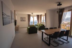 a living room with a table and a couch at Vertmont Villa in Sveti Stefan