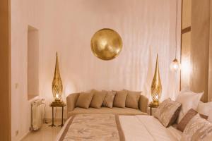 Postel nebo postele na pokoji v ubytování Riad Nyla Wellness and Spa