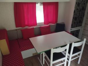 a room with a table and chairs and a window at Best Price #A "LA REMISE" x4 people in Lods