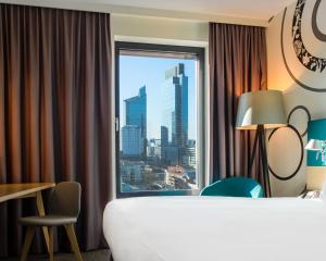 a hotel room with a view of a city at Holiday Inn - Warsaw City Centre, an IHG Hotel in Warsaw