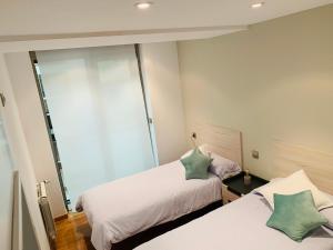 A bed or beds in a room at Viveiro Centro