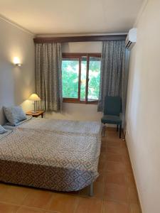 Posteľ alebo postele v izbe v ubytovaní Gemütliches Ferienhaus am Club Nautico, Santa Ponça