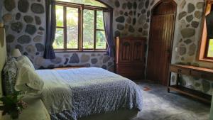 מיטה או מיטות בחדר ב-Casa Cangrejal B&B Hotel