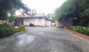 an empty driveway in front of a house at Mid Pine Home Stay in Shillong