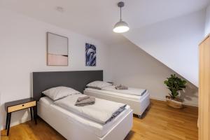 Postel nebo postele na pokoji v ubytování Glück Auf Appartements Lösorter Straße Duisburg