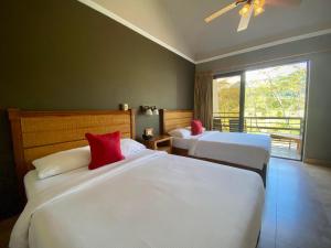 Postel nebo postele na pokoji v ubytování Hotel Ladera