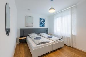 Cama o camas de una habitación en Glück Auf Appartements Lösorter Straße Duisburg