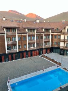 an overhead view of a hotel with a swimming pool at GVC New Gudauri Twins 413 Mountain View in Gudauri