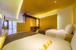 Llit o llits en una habitació de STANFORD Hotel & Resort Jeju