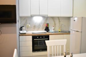 Kuchyň nebo kuchyňský kout v ubytování DelMar Apartments