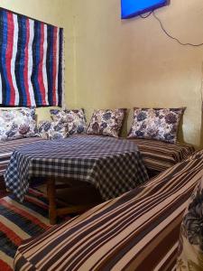 Säng eller sängar i ett rum på Gite d étape Khettara Oasis