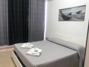 Posteľ alebo postele v izbe v ubytovaní Solemare Beach Apartment Trapani