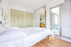 Posteľ alebo postele v izbe v ubytovaní La Tortue Joyeuse - Appartement avec Loggia