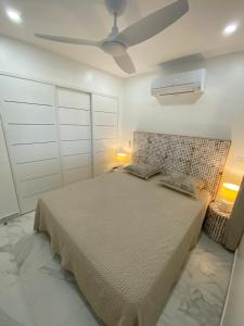 Postel nebo postele na pokoji v ubytování LE FLAMBOYANT VUE LAGON