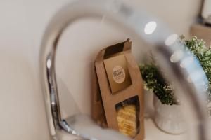 a reflection of a bag of food in a mirror at Petit Luxe Volta Apartaments in Terrassa