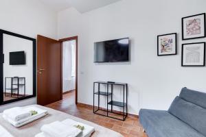A television and/or entertainment centre at BBL - Trevi 2Bdr Apartment