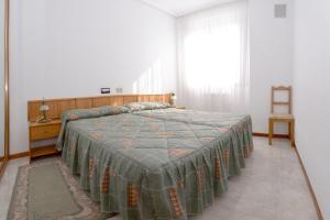 Кровать или кровати в номере Apartamentos La Terraza