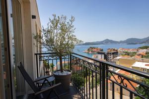 a balcony with a view of the water at Vertmont Villa in Sveti Stefan