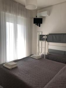 Postel nebo postele na pokoji v ubytování Hotel Oria