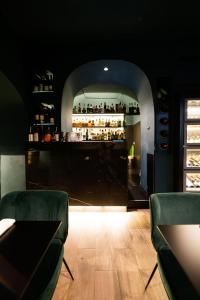 a room with a bar with two chairs and a table at relais metis in Naples