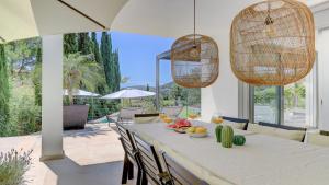 a dining room with a table with food on it at Villa Vista in Crestatx