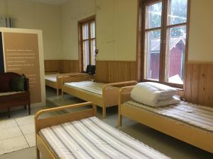 Villa Facklan tesisinde bir odada yatak veya yataklar