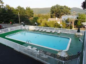 a swimming pool on top of a house at Pinebrook - Three Bedroom House in Lake George