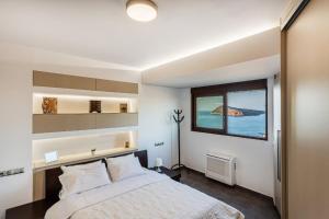 En eller flere senger på et rom på VenMar Luxury Holiday Home