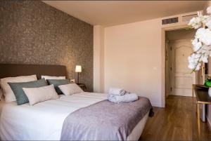 Posteľ alebo postele v izbe v ubytovaní Merced10 3F