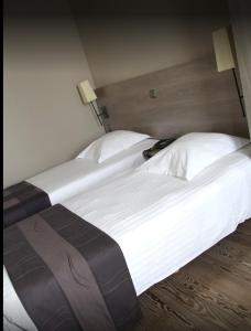 Postel nebo postele na pokoji v ubytování Hotel Arriate