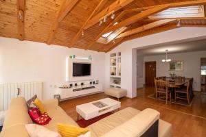 a living room with a couch and a table at Kod Dade in Daruvar