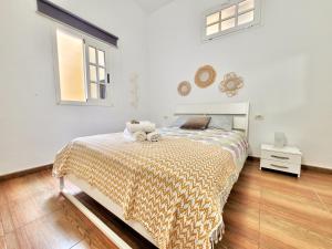 a bedroom with a bed and a window at Casa Anita by TOR in Punta del Hidalgo