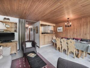 a kitchen and dining room with a table and chairs at Appartement Courchevel 1550, 3 pièces, 6 personnes - FR-1-562-4 in Courchevel
