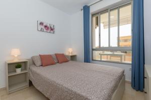 Postel nebo postele na pokoji v ubytování Vista Marina + 21 fotografií