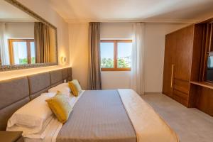 Katil atau katil-katil dalam bilik di Pizzomunno Vieste Palace Hotel