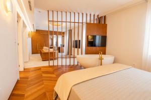 Katil atau katil-katil dalam bilik di Pizzomunno Vieste Palace Hotel