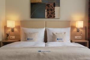Ein Bett oder Betten in einem Zimmer der Unterkunft Select Hotel Tiefenthal
