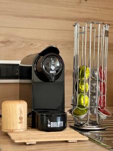 a black blender sitting on a cutting board with food at Profumo di Limoni Vacation Rental in Procida