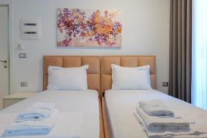 Postel nebo postele na pokoji v ubytování Three Islands Hotel Of Ksamil