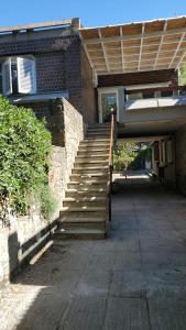 a set of stairs leading up to a building at Puntaalarooms in Punta Ala
