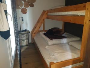 two bunk beds in a room with a ladder at O'Blanche, Viroinval Treignes in Treignes
