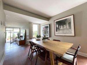 a dining room with a wooden table and chairs at ROOM in Molhe house with pool in Porto