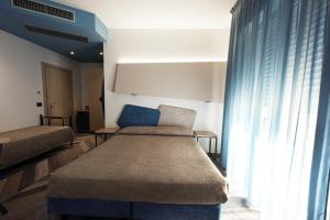 Postel nebo postele na pokoji v ubytování Color Hotel Rimini