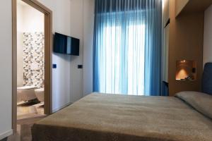 Postel nebo postele na pokoji v ubytování Color Hotel Rimini